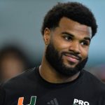 Canadian football player Mesidor smiles wearing a black t-shirt after being drafted by Los Angeles Chargers in NFL draft first round