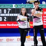 Team Sahaidak and Lott strategize during their match at the Canadian Mixed Doubles Curling Championship in Calgary
