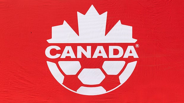 Canada Soccer logo on the sideline at Tim Hortons Field during a soccer event in Hamilton