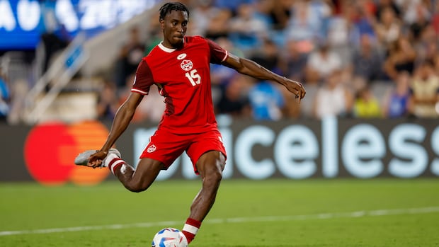 Canada defender Moïse Bombito takes a penalty shot during Copa America third place match against Uruguay