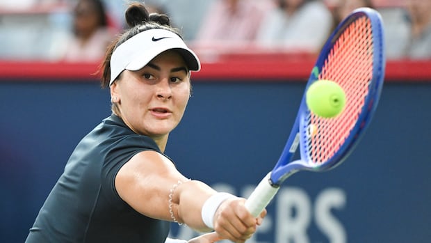 Bianca Andreescu hitting a backhand return during Billie Jean King Cup match between Canada and Kazakhstan