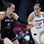 Portland Fire player dribbles past Toronto Tempo defender during WNBA expansion teams' first-ever matchup