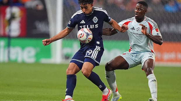 Vancouver Whitecaps forward Rayan Elloumi controls the ball against FC Dallas defender Osaze Urhoghide during MLS match in Frisco Texas