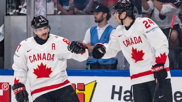 Canadian men's hockey players celebrate a goal during the third period against Slovakia at the hockey worlds