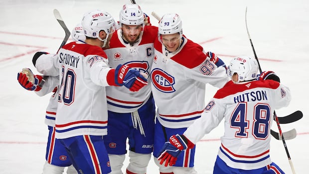 Montreal Canadiens player scoring a goal against Buffalo Sabres during intense Game 5 action