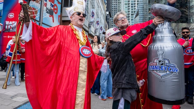 Montreal Canadiens fans gather outside the Bell Centre showing team spirit before a playoff game
