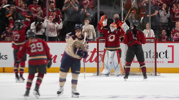 Five Ottawa Charge players celebrating on the ice after their comeback victory against Montreal Victoire