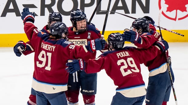 Victoire players celebrate Roque's overtime winning goal against Charge in Walter Cup final Game 1