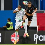 Canadian and Irish players jump to head the ball during a soccer match ahead of the FIFA World Cup