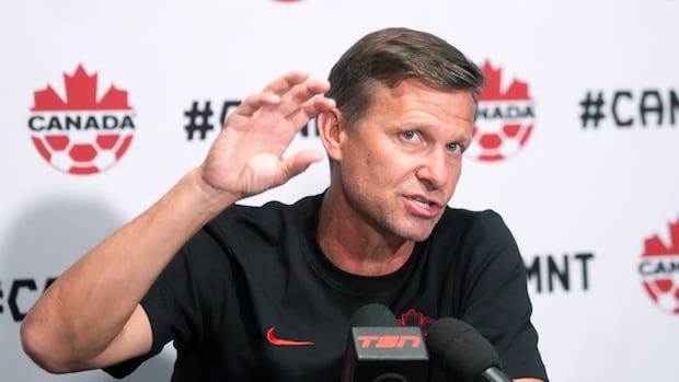Canada's World Cup coach giving a speech during a training session in the United States