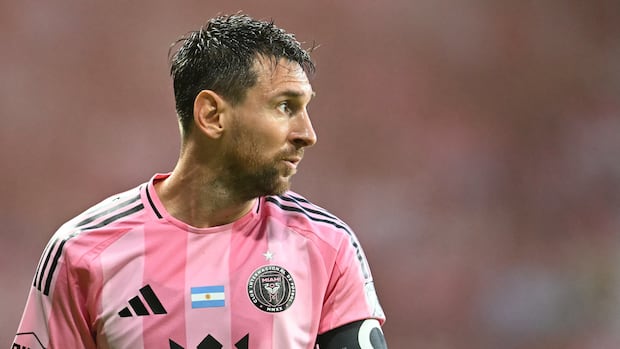 Soccer player in action eyes focused on the ball during an intense match