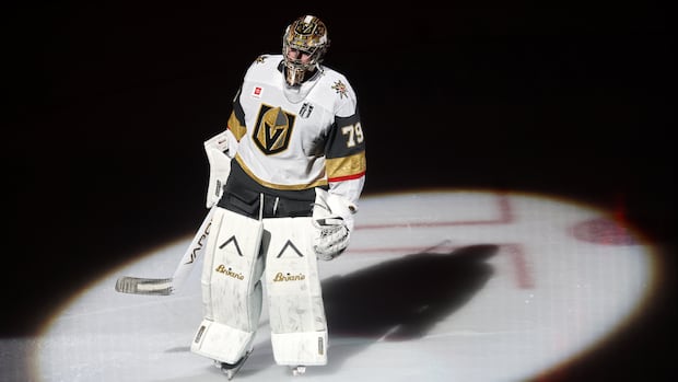 NHL goaltender Carter Hart focused and ready on the ice during a game