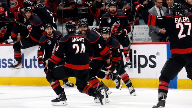 Hurricanes players celebrate Jarvis scoring the overtime goal to tie Stanley Cup final against Golden Knights