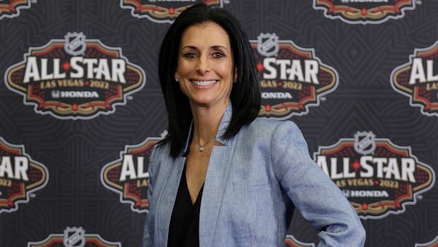 Manon Rhéaume smiles in front of an All Star Las Vegas 2022 backdrop during a hockey event