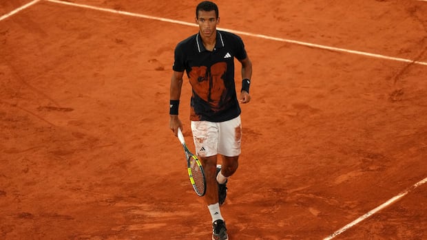 Felix Auger-Aliassime reacting during French Open quarterfinal match against Cobolli on clay court